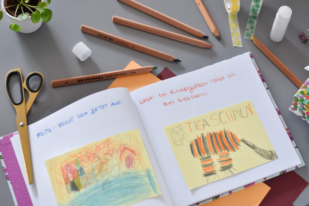 Kinderzeichnungen in einem Erinnerungsalbum vom Grätz Verlag als Abschied für Erzieher